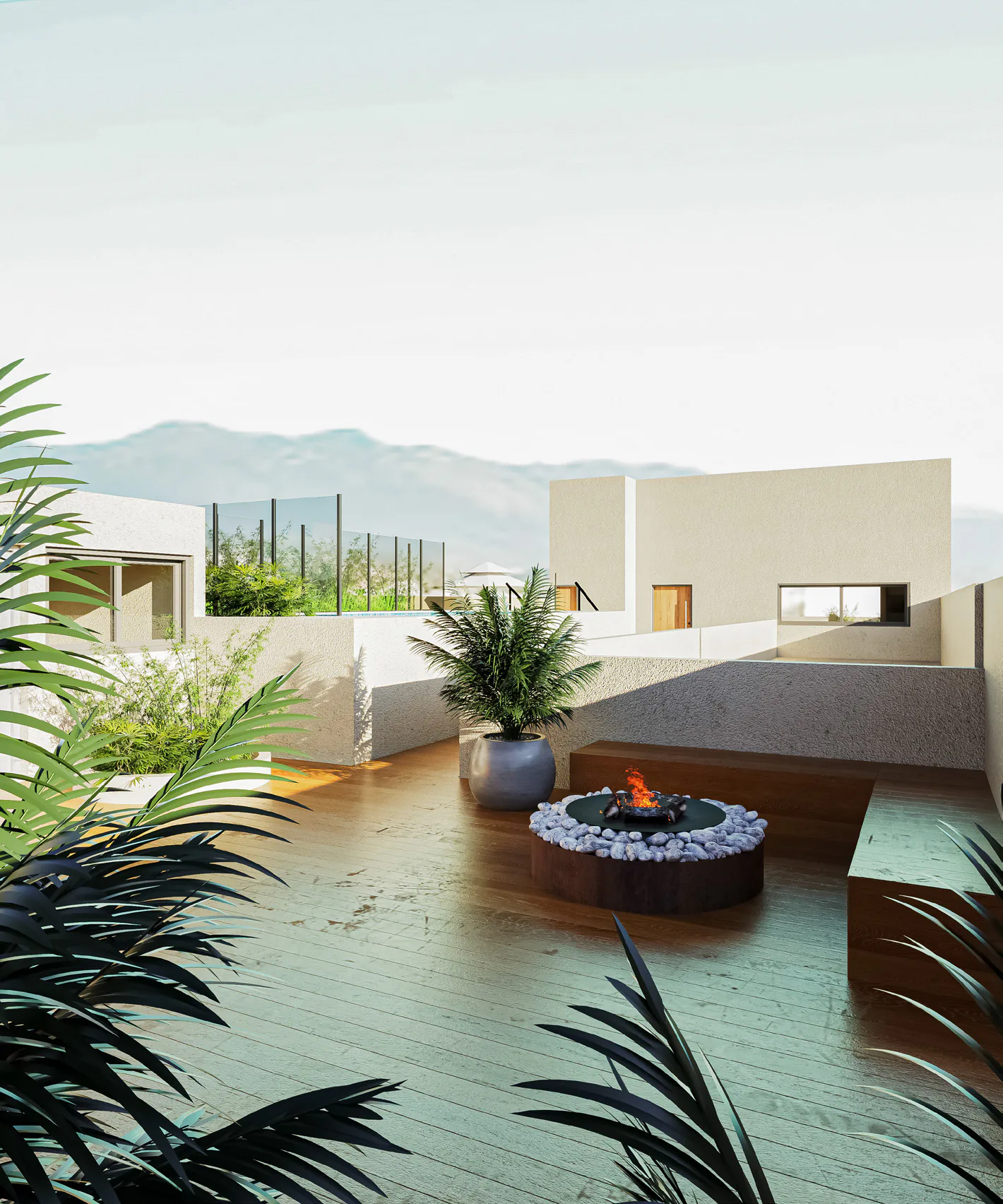 Terraza con deck de madera, fogonero redondo, bancos bajos y plantas en macetas, con las sierras de fondo