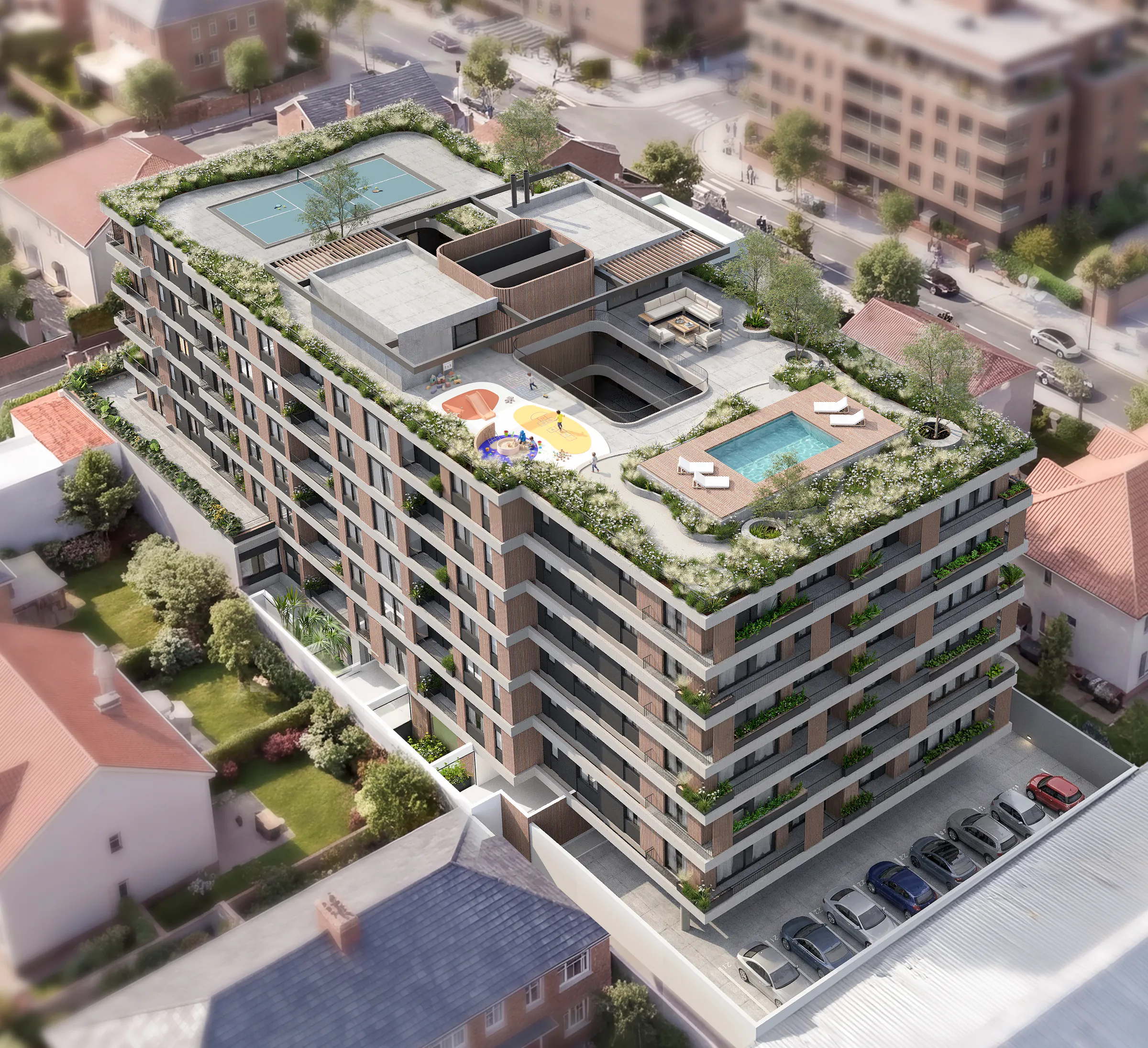 Vista aérea de Torre Veinte con la terraza de amenities: cancha de pickleball, pileta con reposeras, juegos infantiles de colores y un sector de estar entre canteros con plantas, alrededor del vacío del patio; abajo, cocheras descubiertas