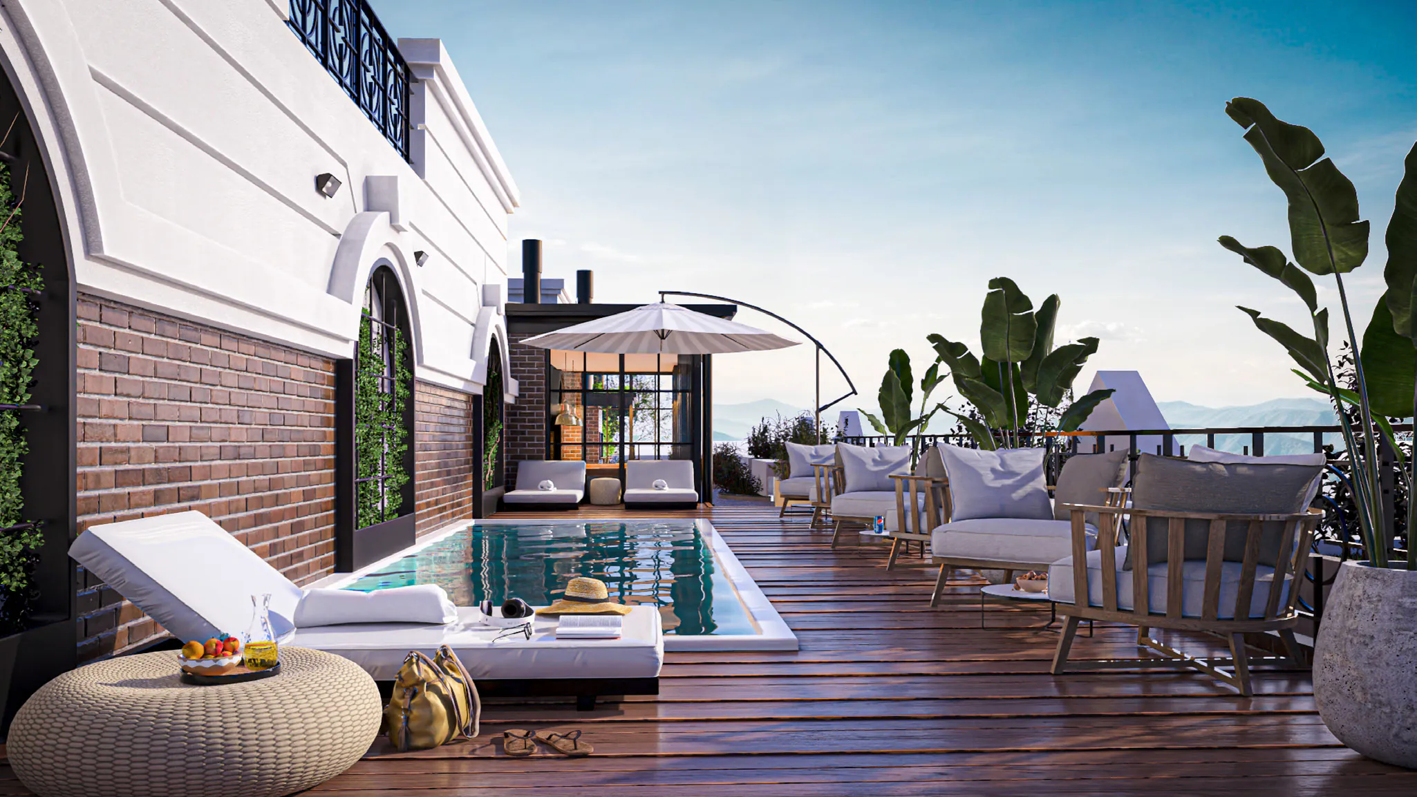 Pileta en la terraza con deck de madera, reposeras blancas, sillones, sombrilla y plantas, junto a un muro de ladrillo con arcos
